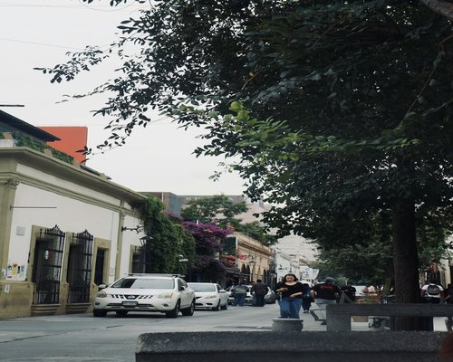 Busy street traffic and people walking fast in Monterrey